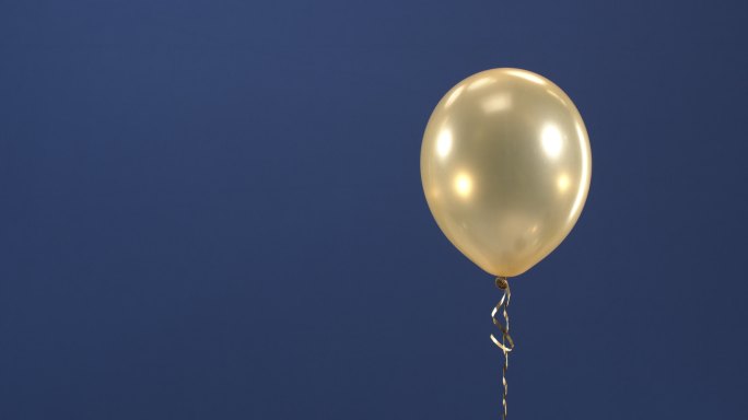 一个金色的气球漂浮空镜背景