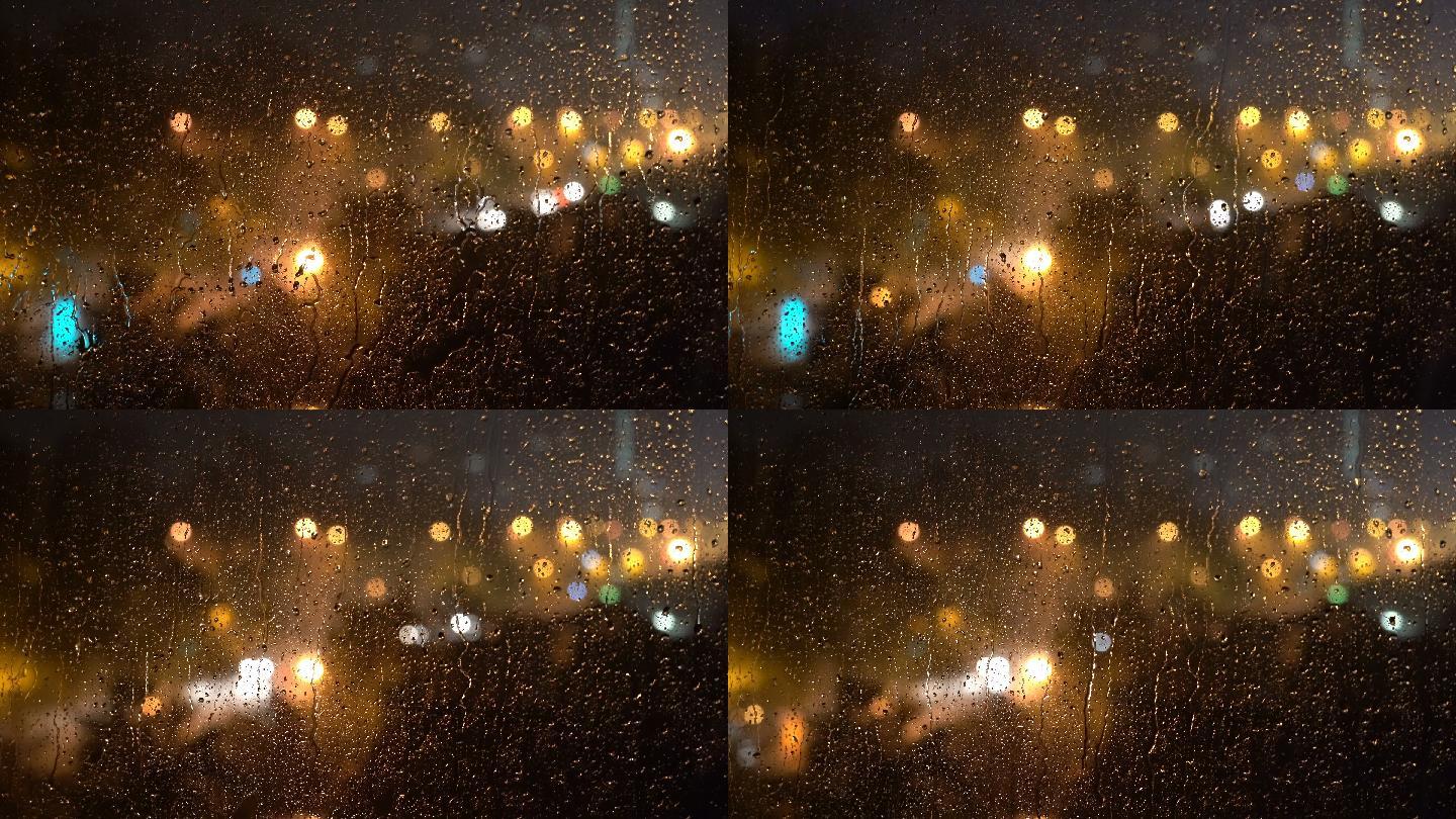夜雨窗下的城市地在车窗上玻璃窗外下雨窗外