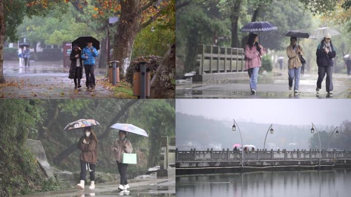 公园下雨行人散步文艺人文素材