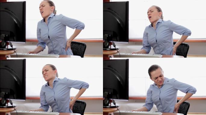 背痛的年轻女商人腰痛座椅人体力学工程椅