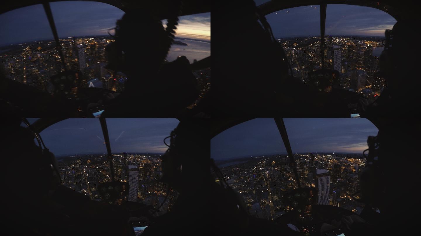 西雅图建筑物上空飞行的直升机驾驶舱看夜景