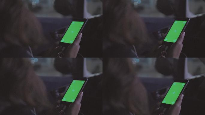 绿色屏幕，色度键使用智能手机的人
