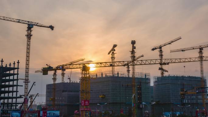 上海临港建筑工地日落吊车塔吊施工房地产