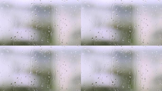 雨滴在窗户玻璃上雨水滴落雨夜湿润冷空气景
