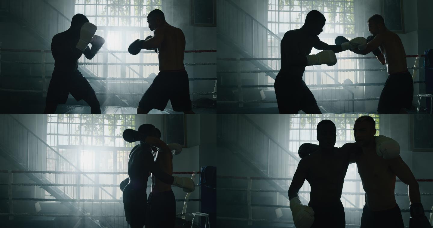两名男子拳击手在拳击场上打斗。