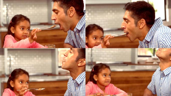 给父亲喂食的小女孩