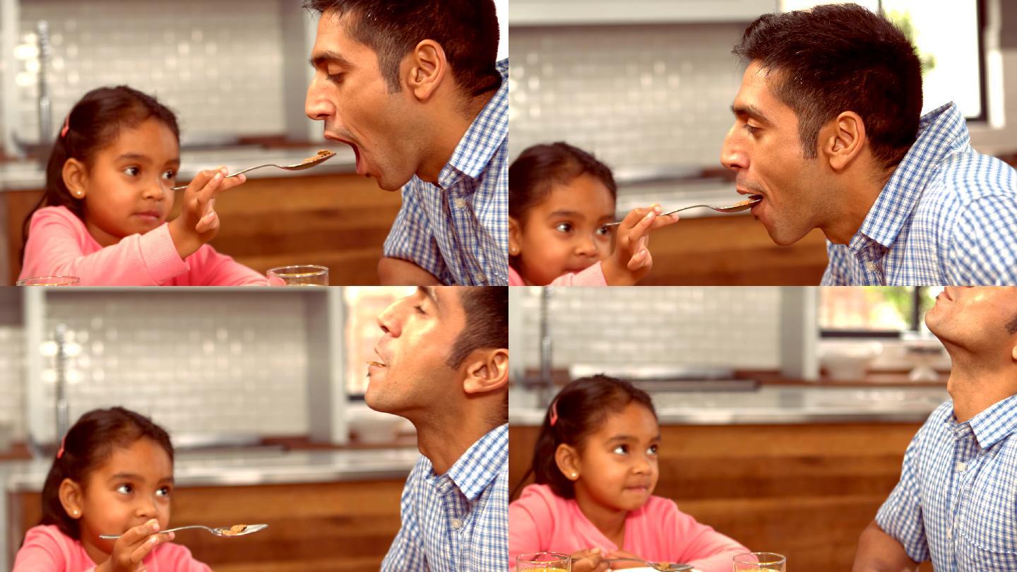 给父亲喂食的小女孩