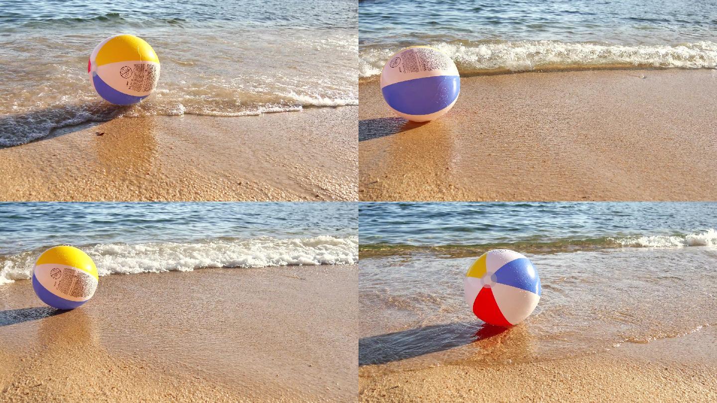 海滩上的沙滩球大海浪花玩耍
