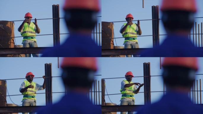 非洲建筑工地建筑工人吹哨指挥吊车