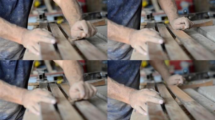 专业木匠打磨和修整木材表面。