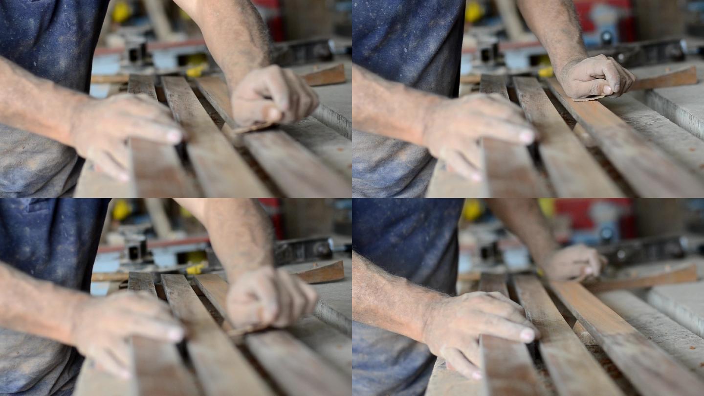 专业木匠打磨和修整木材表面。