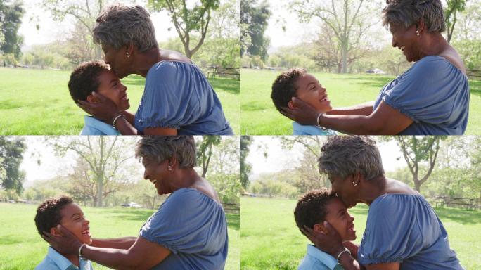 祖母在公园亲吻孙子的慢镜头