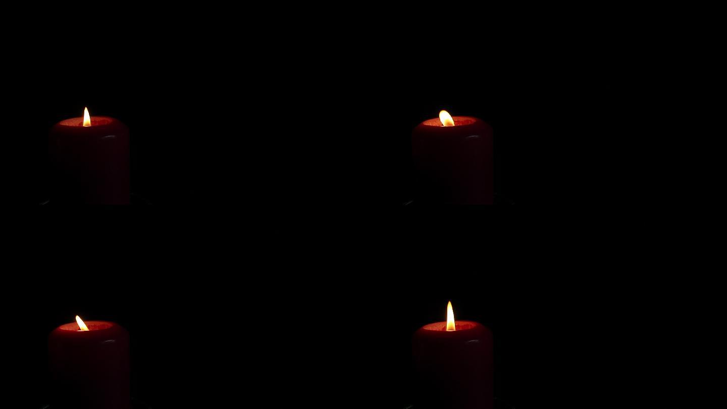近距离单烛焰烛火蜡烛黑暗光明