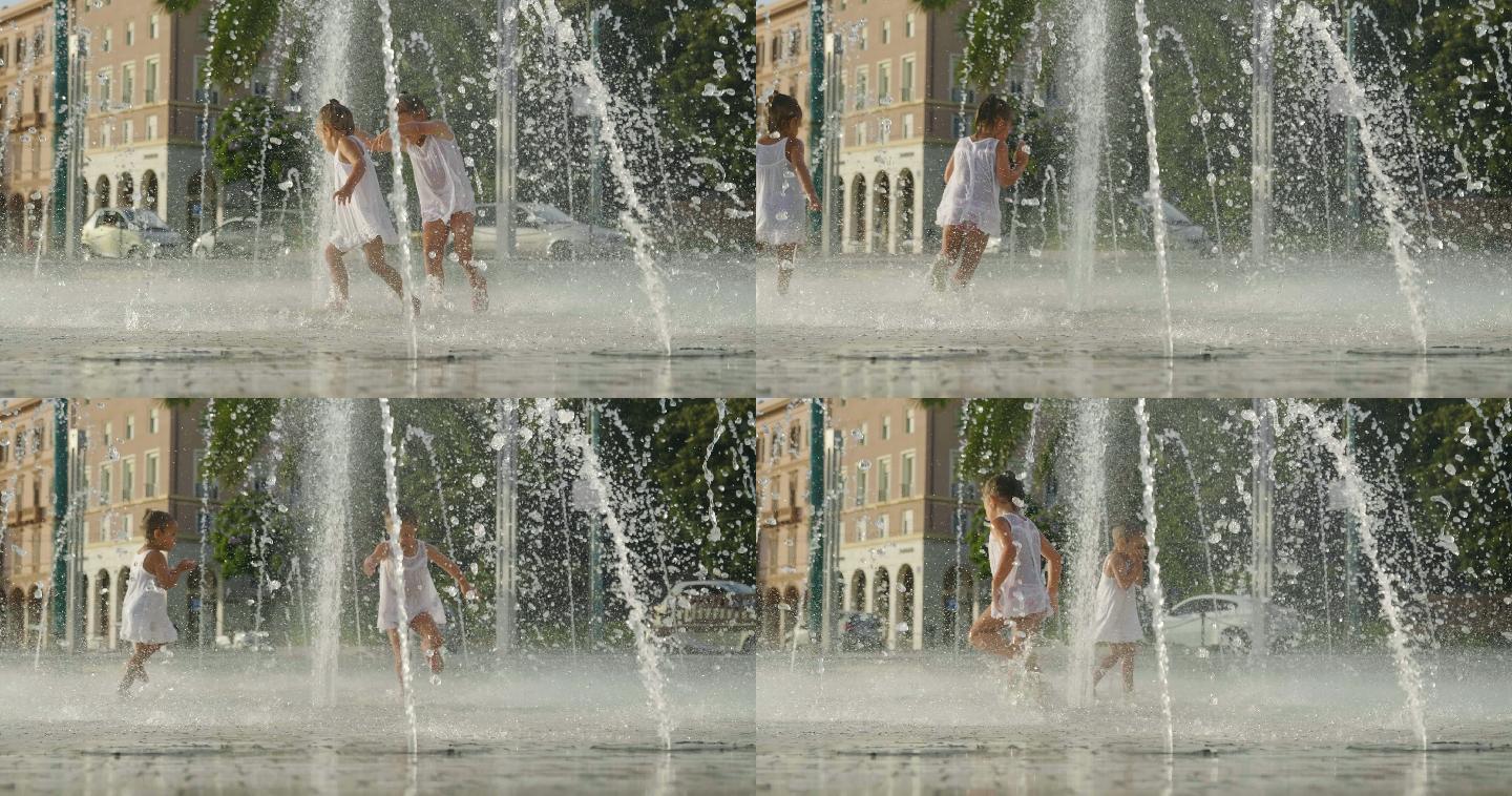 两个小女孩在喷泉里玩耍