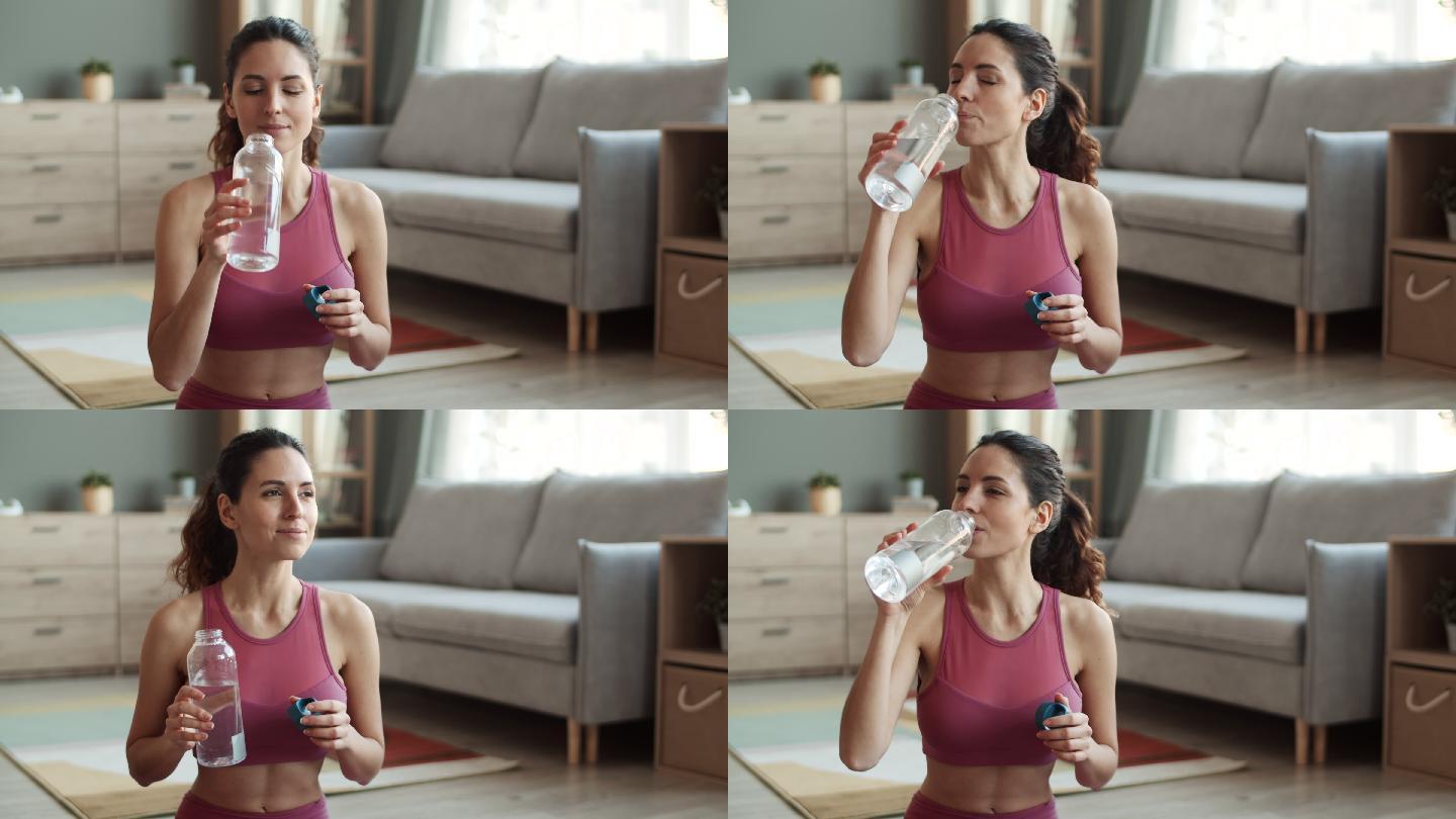 喝水的女人沙发客厅喝水口渴视频素材