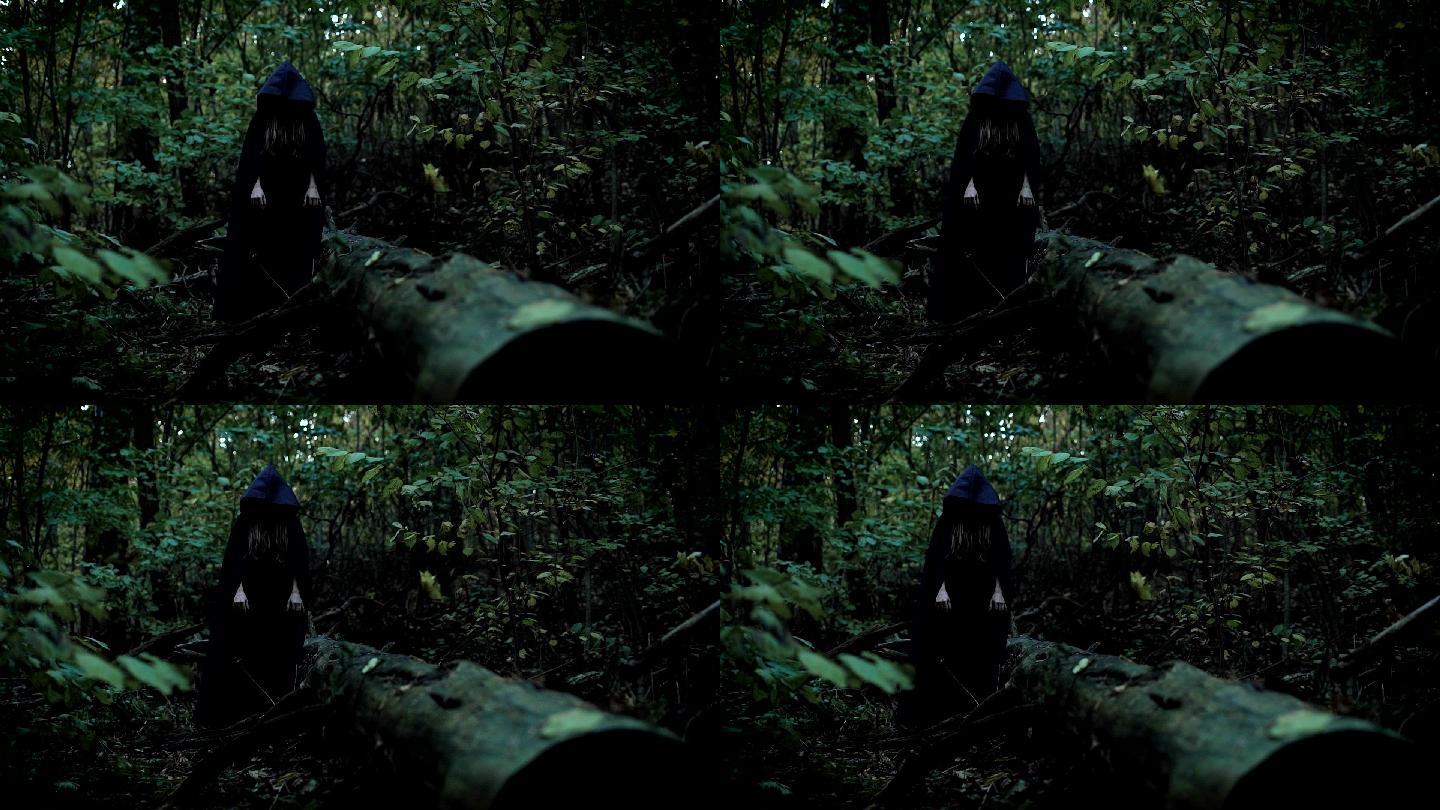 可怕的女人独自站在森林深处