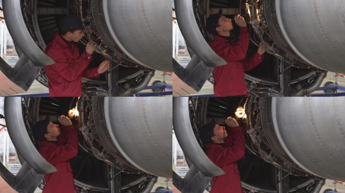 工程师检查飞机的发动机