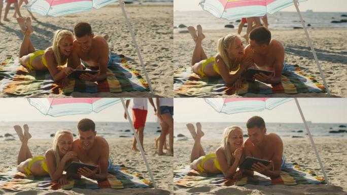 微笑的年轻夫妇沙滩情侣度假比基尼泳装互联