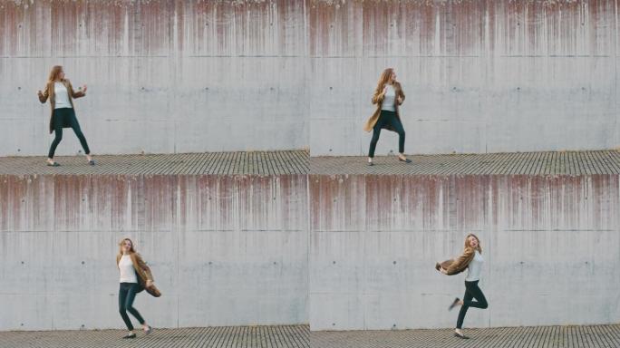 金发女性在城市水泥墙旁的街道上行走