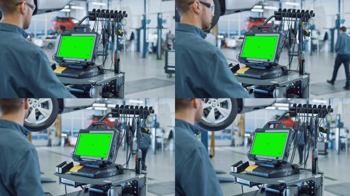 汽车维修技工在一台绿色屏幕的计算机上工作