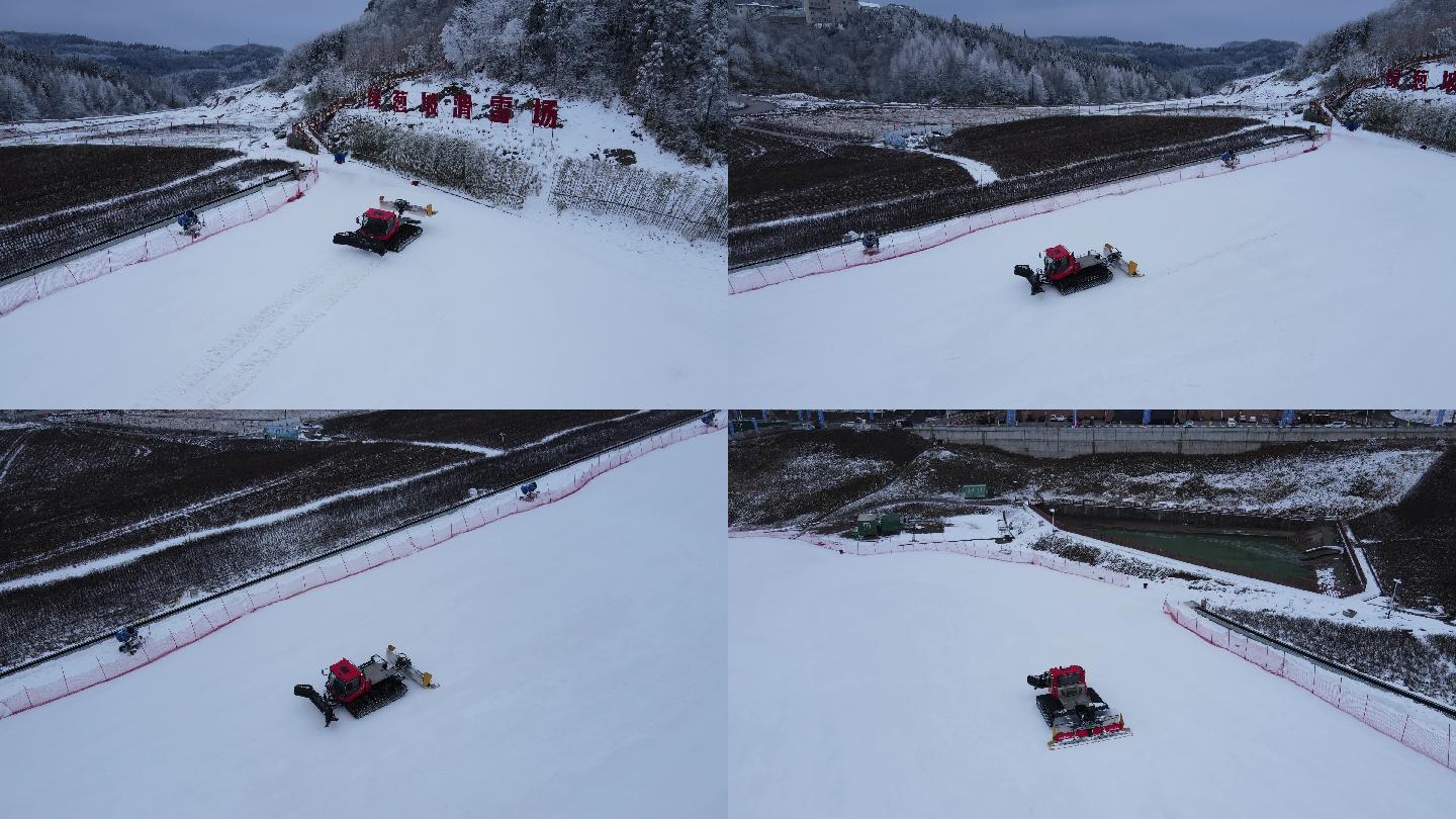 航拍滑雪场铲雪车工作作业