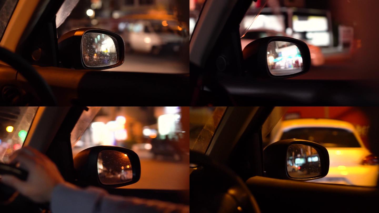 夜间城市街道的移动汽车侧视镜