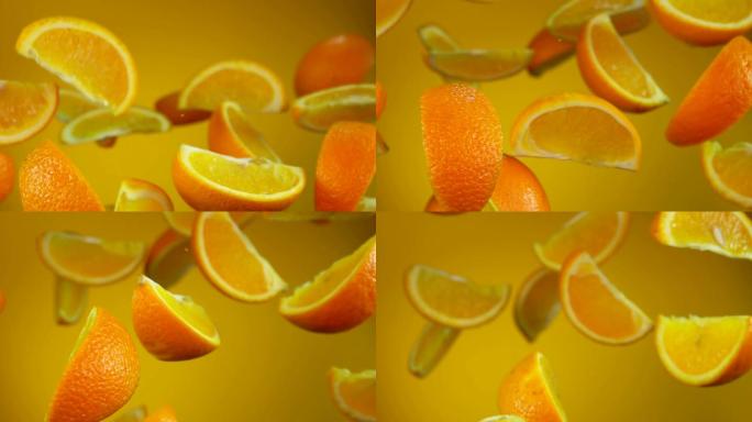 多汁的橘子片在黄色背景上飞扬旋转