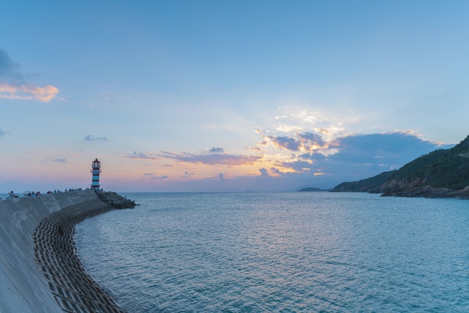 海南万宁神州半岛灯塔晚霞日转夜延时8k