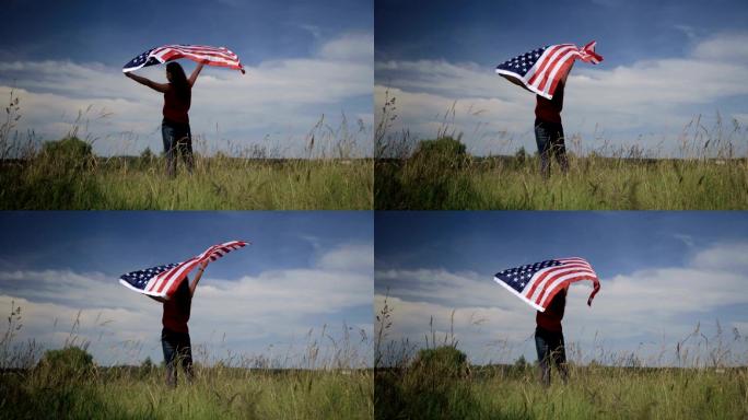 骄傲的美国女孩拿着星条旗
