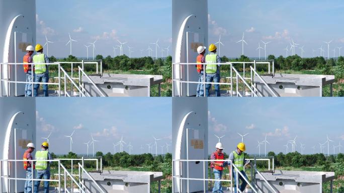 两名工程师正在检查风力发电场风力涡轮机