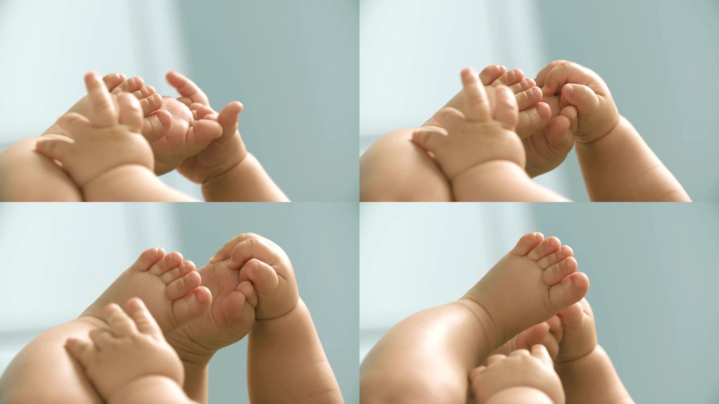 婴儿手与婴儿脚近距离玩耍