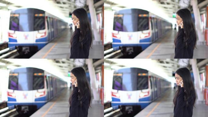 美丽的亚洲女性等车站台月台车站美女女人