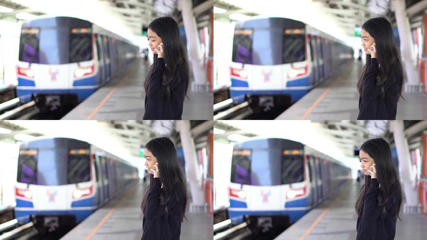 美丽的亚洲女性等车站台月台车站美女女人