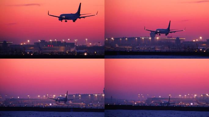 傍晚迷人晚霞民航客机缓缓降落在哈尔滨机场