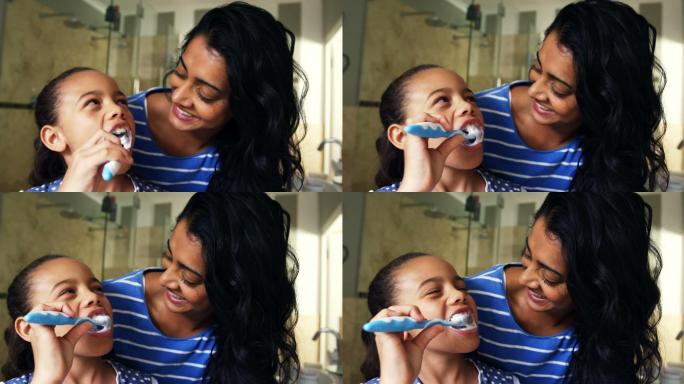 在刷牙的小女孩家庭牙刷护理快乐母子刷牙童