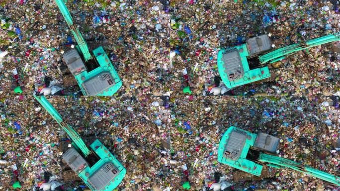 鸟瞰垃圾车将垃圾卸到垃圾填埋场