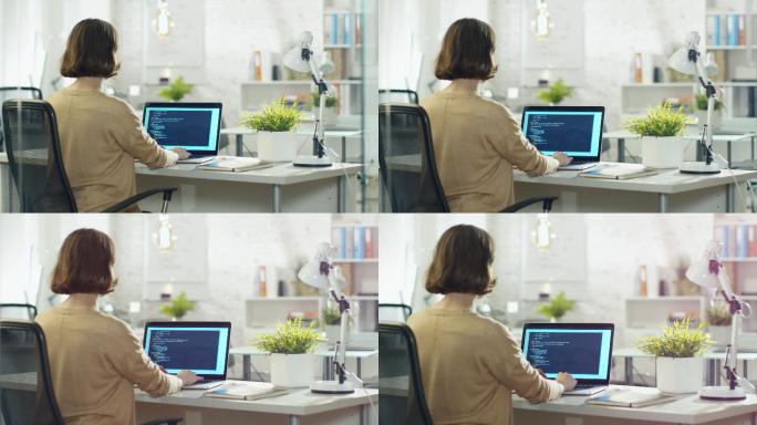 女开发者在台式电脑上写代码