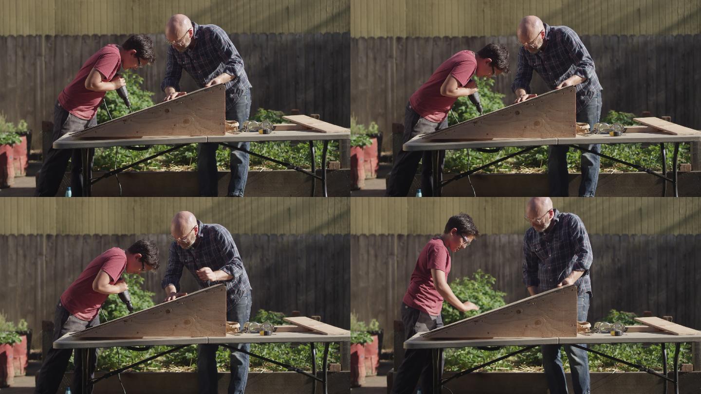 一位父亲和他的儿子在后院建了一个木制坡道