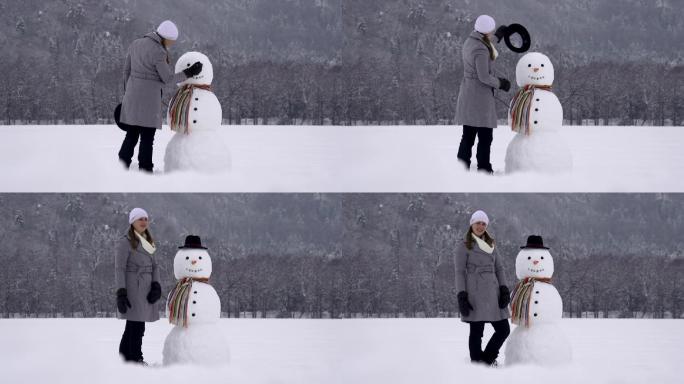 堆雪人的女孩视频素材