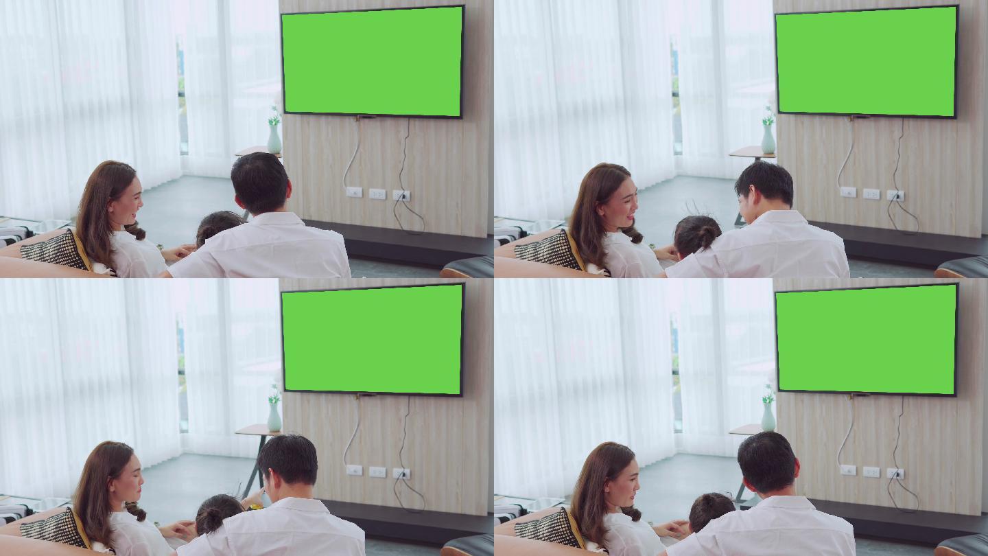 绿色屏幕的电视机亲自陪伴一家三口绿幕抠像