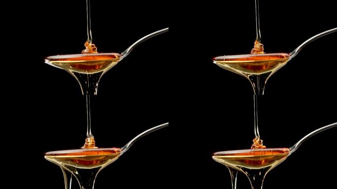 蜂蜜倒在钢勺上，慢动作