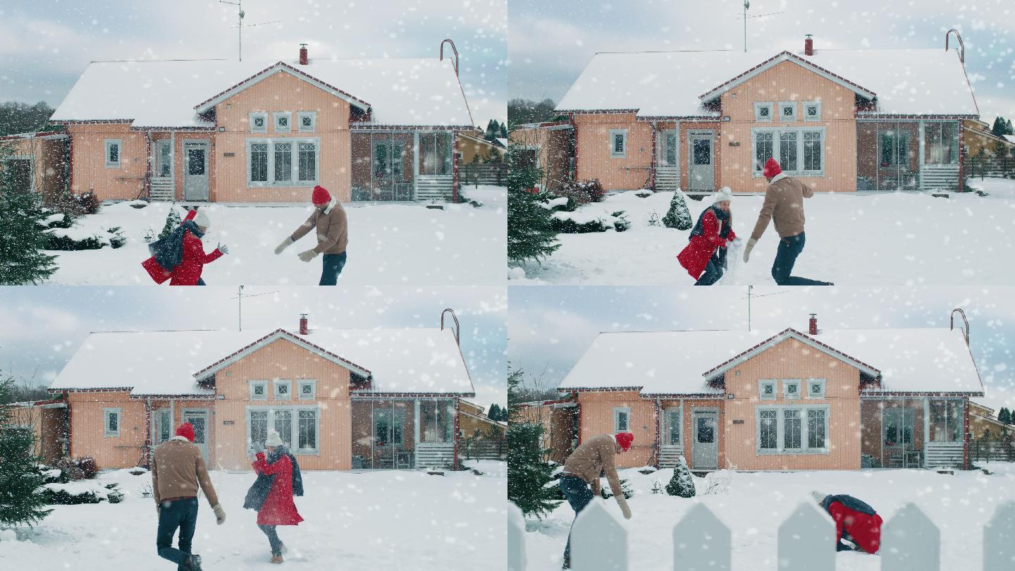 夫妇在下雪时互相扔雪球