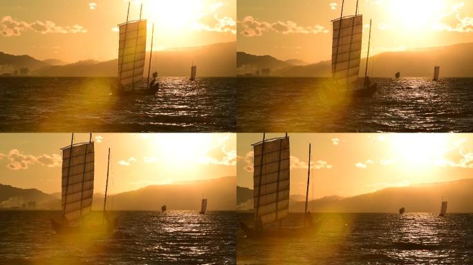 夕阳时湖泊中的帆船