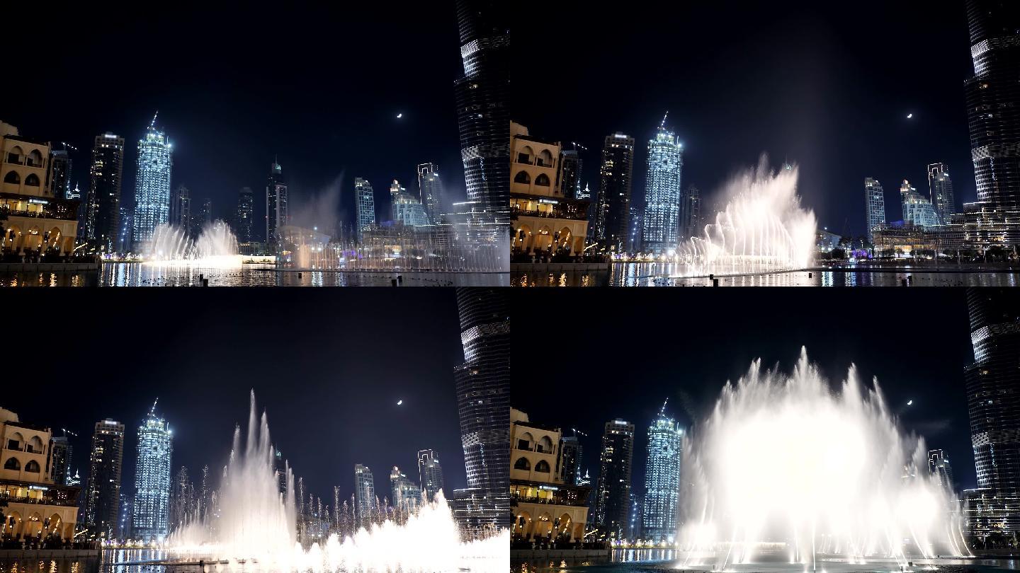 夜间城市灯光下的喷泉