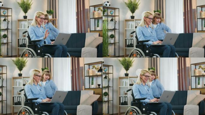 残疾妇女和她女儿残障人士坐轮椅国外妈妈
