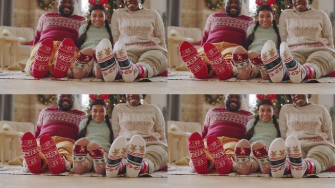 穿着圣诞袜的快乐家庭的双腿