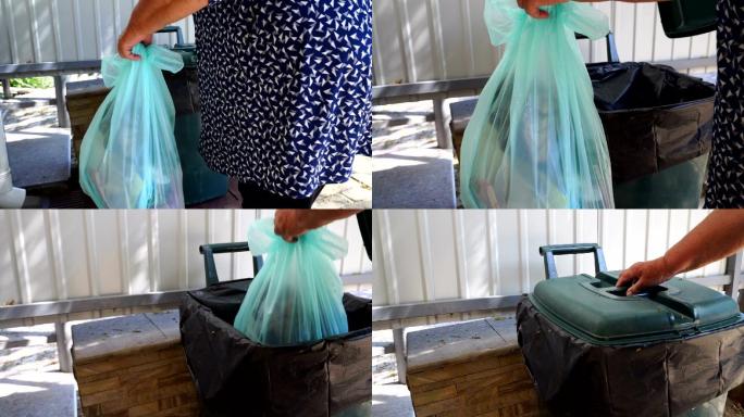 妇女提着垃圾袋，把塑料垃圾袋放进垃圾桶