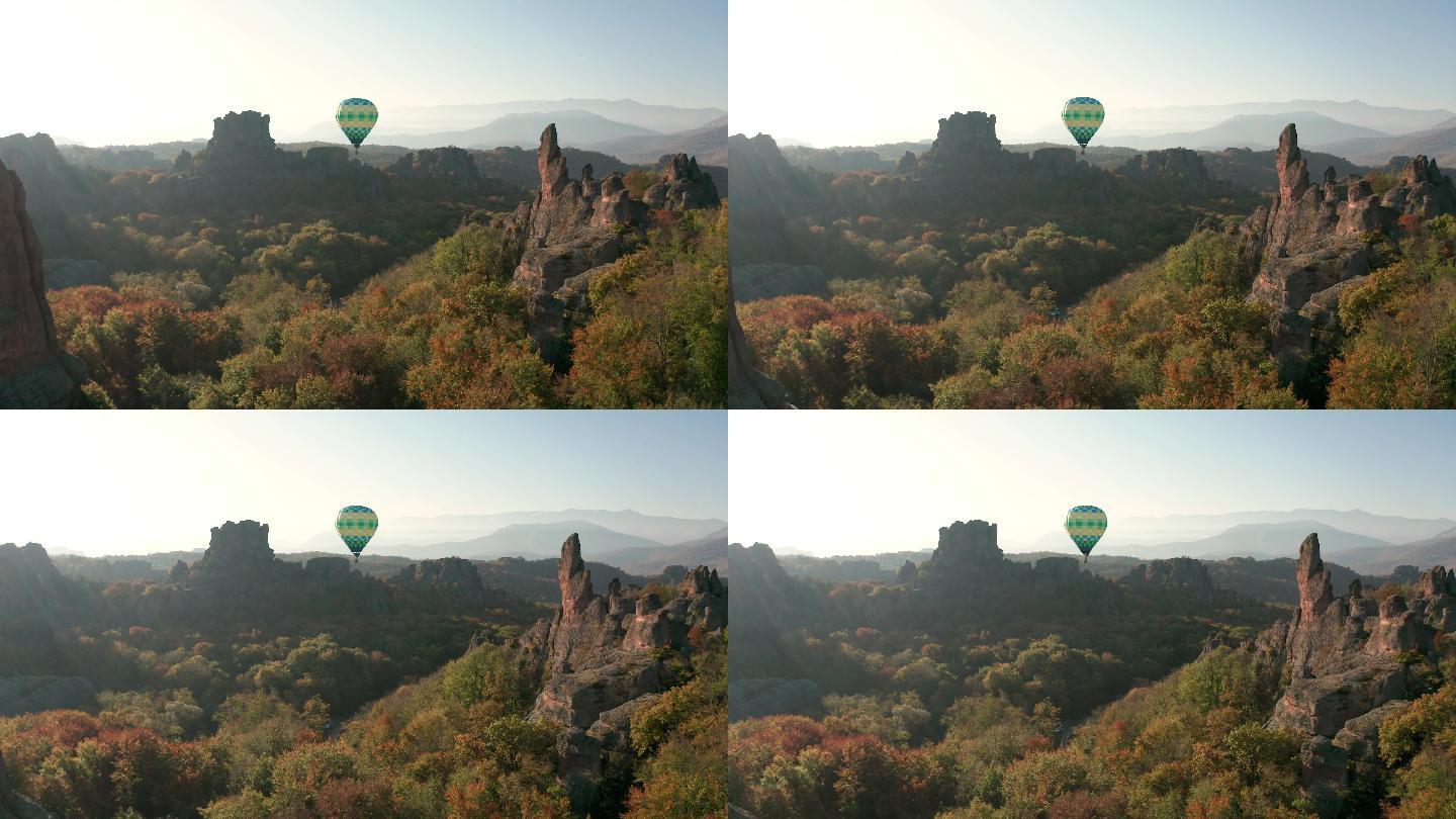 热气球在风景如画的岩层上飞过