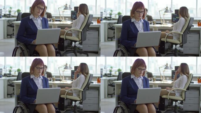 截瘫女商人在办公室用笔记本电脑打字