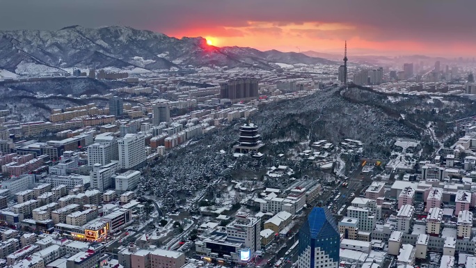 山东威海雪后城市日落山东大雪